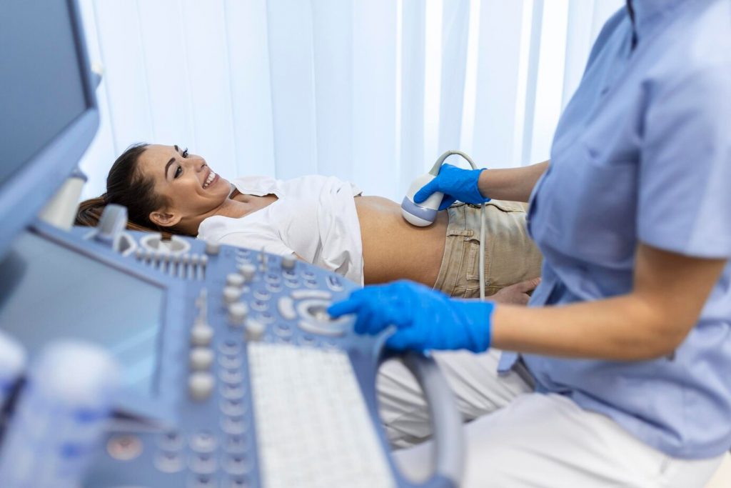 ultrasound-diagnostic-stomach-abdominal-woman-clinic-closeup-view-doctor-runs-ultrasound-sensor-patient-s-girl-tummy-looks-image-screen-diagnosis-internal-organs_657921-346